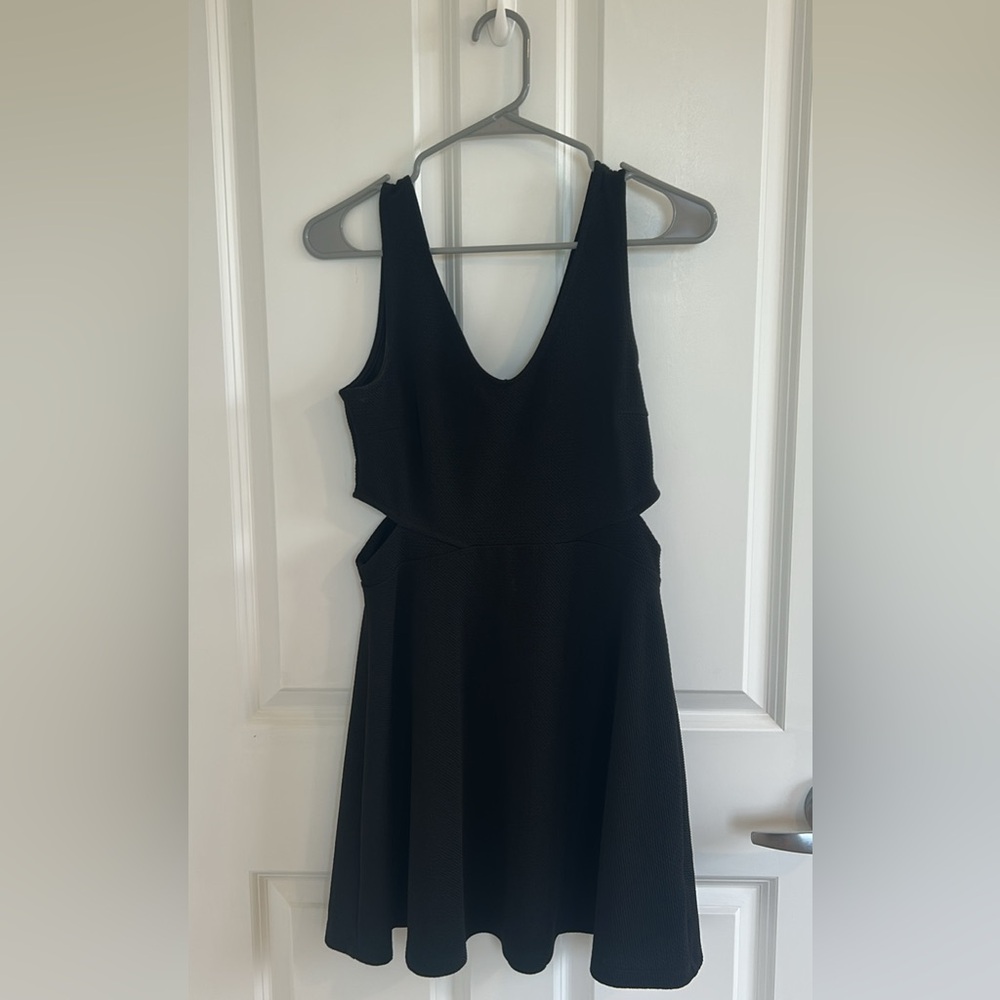 Medium black “soprano” brand dress with cut outs at waist